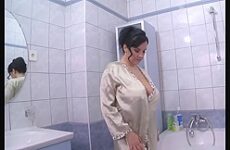 Horny milf rubs her big tits in a soapy bubble bath